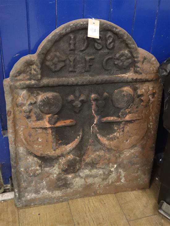 A cast iron fireback dated 1588 H.68cm